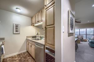 a kitchen with a sink and a dishwasher at CW B206 Rivers Edge in New Braunfels