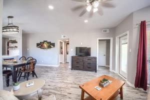 a living room with a table and a dining room at IC 309 Wine Dine in New Braunfels