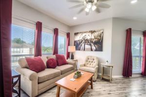 a living room with a couch and a table at IC 309 Wine Dine in New Braunfels +22 photos