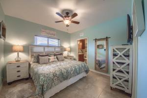 a bedroom with a bed and a ceiling fan at RG 105 Rio Refuge in Canyon Lake
