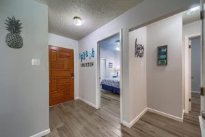 a hallway with a room with a bed and a door at CW C107 Spritzen Haus in New Braunfels