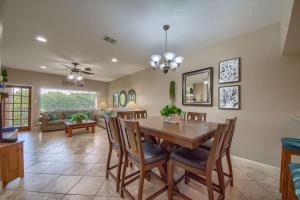 a dining room and living room with a table and chairs at CW C207 River Zen in New Braunfels +29 photos