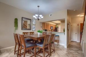 a dining room and kitchen with a table and chairs at CW C207 River Zen in New Braunfels