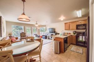 a kitchen and living room with a table and chairs at WW H303 Dreams and Streams in New Braunfels