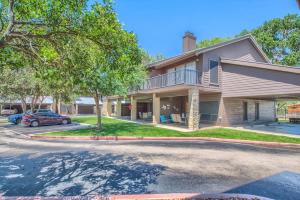 a house with a car parked in front of it at CW C101 Condo de Comal in New Braunfels