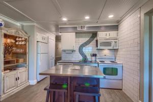 a kitchen with a island in the middle of it at RRC A302 River Hippie in New Braunfels