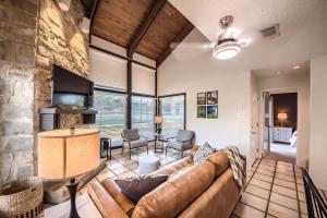 a living room with a couch and a table at TBM 112 Among The Oaks in New Braunfels