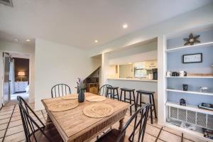a dining room with a wooden table and chairs at TBM 112 Among The Oaks in New Braunfels