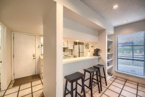 a kitchen with a counter and stools in a room at TBM 112 Among The Oaks in New Braunfels +34 photos