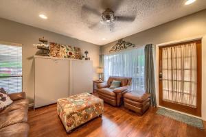 a living room with a couch and a chair at CW C104 Fun on the Comal in New Braunfels