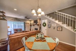 a dining room with a table and a couch at CW C104 Fun on the Comal in New Braunfels