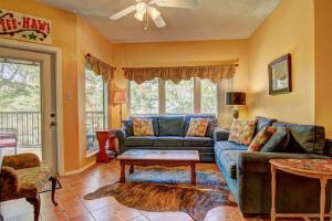 a living room with a couch and a table at IC 110 Comal Corral in New Braunfels