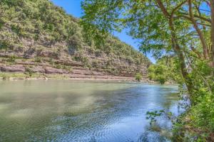 a view of a river with trees and a mountain at RR 464 Sattler Haus in Canyon Lake