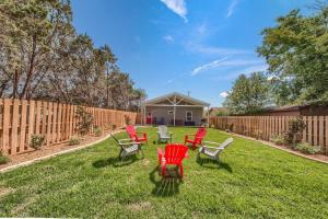 a group of chairs sitting in a yard at RR 464 Sattler Haus in Canyon Lake