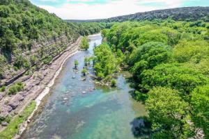 an aerial view of a river with trees at RR 464 Sattler Haus in Canyon Lake