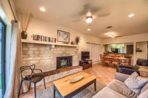 a living room with a couch and a fireplace at CW C109 River Bend in New Braunfels