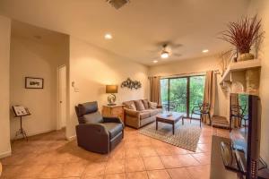 a living room with a couch and a chair at CW C109 River Bend in New Braunfels
