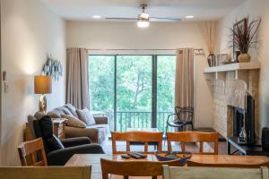 a living room with a couch and a table at CW C109 River Bend in New Braunfels +41 photos
