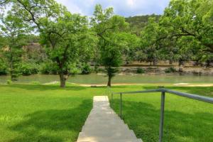 a path leading to a park with a lake at RG 306 Hillside River Retreat in Canyon Lake