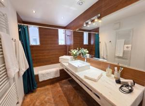 a bathroom with a sink and a large mirror at Casa da Madrugada in Salema +21 photos