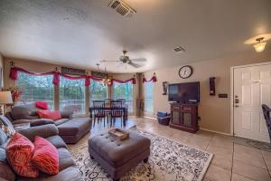 a large living room with a couch and a table at WW D302 Chateau Relaxeau in New Braunfels