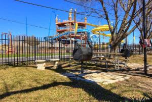 a playground with a slide in a park at CW B202 Camp Boogie Bahn B202 in New Braunfels