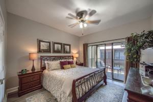a bedroom with a bed and a ceiling fan at CW B202 Camp Boogie Bahn B202 in New Braunfels
