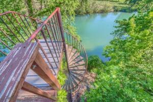 a wooden bridge over a body of water at SS B4 Riverside Condo in New Braunfels