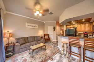 a living room with a couch and a kitchen at SS B4 Riverside Condo in New Braunfels +20 photos