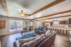 a living room with a couch and a table at RR 1300 Hondos River Haus in Canyon Lake