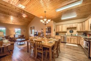 a kitchen and living room with a table and chairs at OM A14 Gruene Bridge Bungalow at Old Mills Resort in New Braunfels