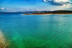 a large body of water with an island in the distance at CL 874 Million Dollar View in Canyon Lake