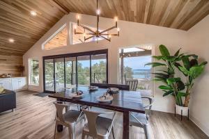 a dining room with a wooden ceiling and a table and chairs at CL 874 Million Dollar View in Canyon Lake