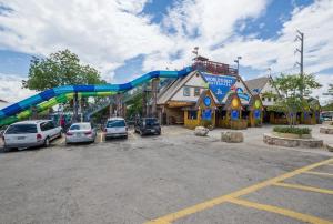 a playground in a parking lot with cars parked at DT 534 Castle Shadow Cottage in New Braunfels +18 photos