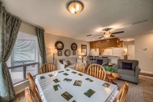 a dining room and living room with a table and chairs at CRC 317 Timeless Tranquility in New Braunfels