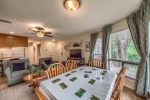 a dining room and living room with a table and chairs at CRC 317 Timeless Tranquility in New Braunfels +14 photos