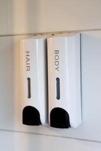 a couple of routers sitting on a shelf at Knus Relaxchalet met Privé Hottub in Voorthuizen