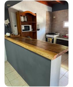 a kitchen with a counter top in a kitchen at Tres Raíces in Miramar