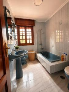 a bathroom with a tub and a sink and a bath tub at Casa Bolumburu in Pontevedra +34 photos