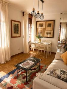 a living room with a couch and a table at Casa Bolumburu in Pontevedra