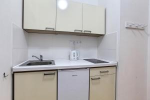 Kuchyň nebo kuchyňský kout v ubytování Angel City Aparthotel