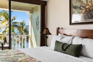a bedroom with a bed with a view of the ocean at Lahaina Shores 515 in Lahaina +45 photos