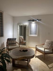 a living room with two chairs and a table at Estudio 201 Barrio blanco Estrato 5 in Cúcuta