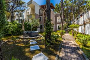 an exterior view of a house with a garden at The Garden Jacuzzi Apartment By PS in Golem