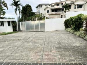 an empty parking lot in front of a building at 3BR Oceanview Villas - Raisara Retreat, Central Suva in Suva