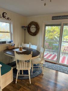 a dining room with a table and chairs at Dragonfly Cottage in Plymouth