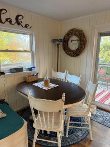 a dining room with a table and chairs at Dragonfly Cottage in Plymouth +19 photos