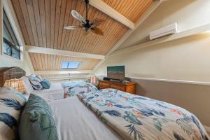 a bedroom with a bed and a ceiling fan at Kahana Village 4 in Lahaina +48 photos
