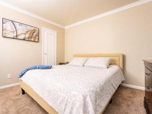 a bedroom with a bed and a dresser at Relaxing Condo with Parking - Minutes to Old Town! in Scottsdale +17 photos