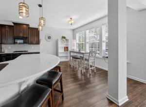 a kitchen and dining room with a white table and chairs at Spacious Family Gathering Space Privacy Zones Quiet, Convenient Neighborhood in Middletown